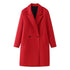 Red double-breasted long overcoat by Carmine Juneberry, stylish jacket with wide lapels and button details, on a hanger.