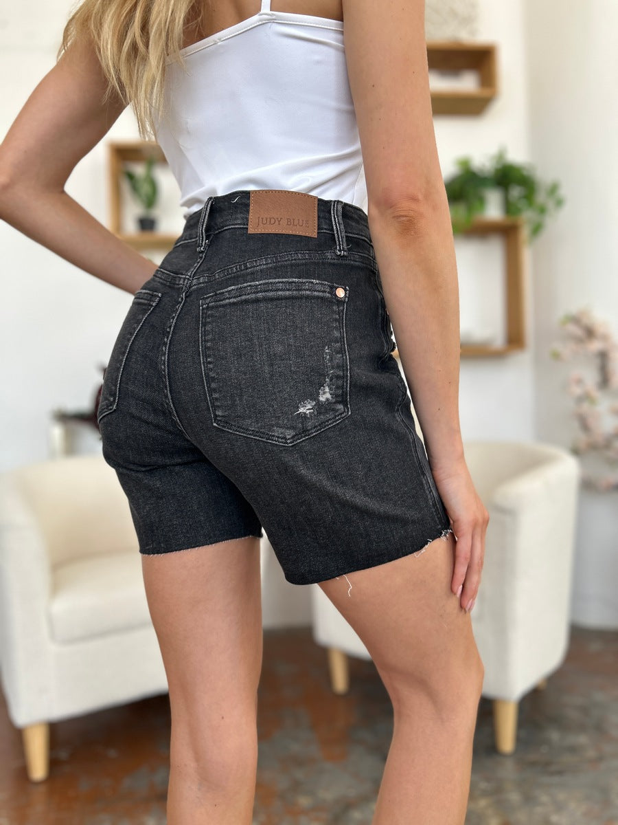 Judy Blue high waist rigid magic denim shorts for women, showcasing fitted style and classic denim texture.