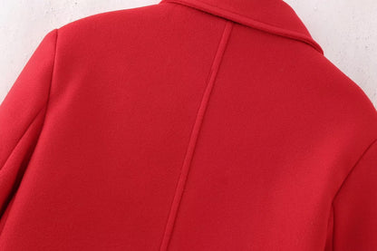 Red double-breasted long overcoat by Carmine Juneberry, stylish jacket with a tailored fit and classic lapel design.