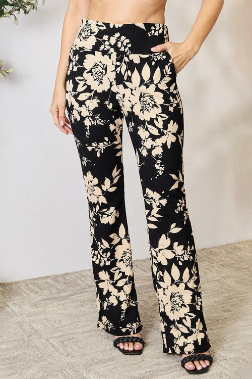 Jade Icarus Heidi Flare Pants in lightweight fabric, showing their high-waisted fit and flared leg design.