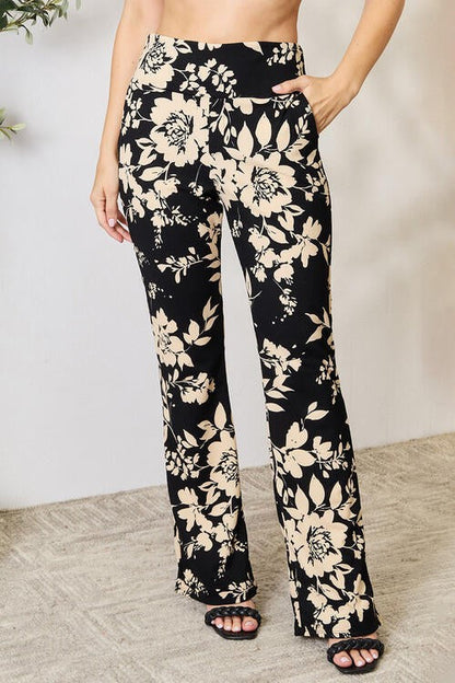 Jade Icarus Heidi Flare Pants in lightweight fabric, showing their high-waisted fit and flared leg design.