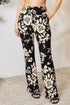 Jade Icarus Heidi Flare Pants in lightweight fabric, showing their high-waisted fit and flared leg design.