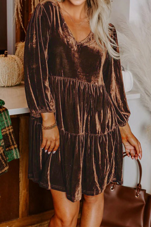 Velvet V-neck long sleeve tiered mini dress by Byzantium Bay, showcasing a stylish women&