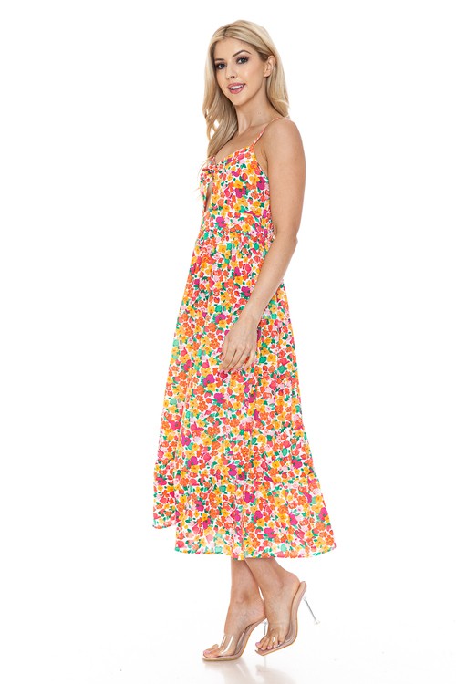 Women’s floral maxi dress by Jade Icarus displayed on a model, featuring a flowing design with vibrant floral patterns.