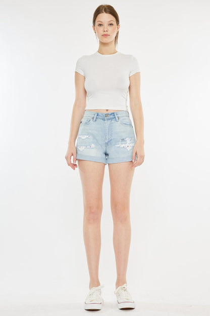 Automotive Jade Icarus Kancan high-rise repaired mom denim shorts, stylish and distressed, displayed on a model.