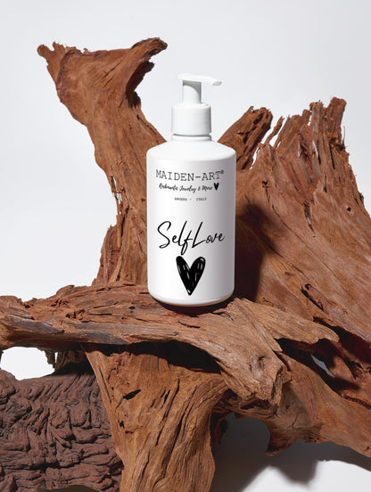 Pink Lucky Self-Love Bliss moisturizing body lotion bottle with floral design, showcasing creamy texture and relaxing bodycare benefits.