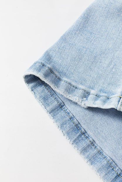 Carmine Juneberry Beau Blue vintage light wash distressed flare jeans, showing fit and stylish distressed details.