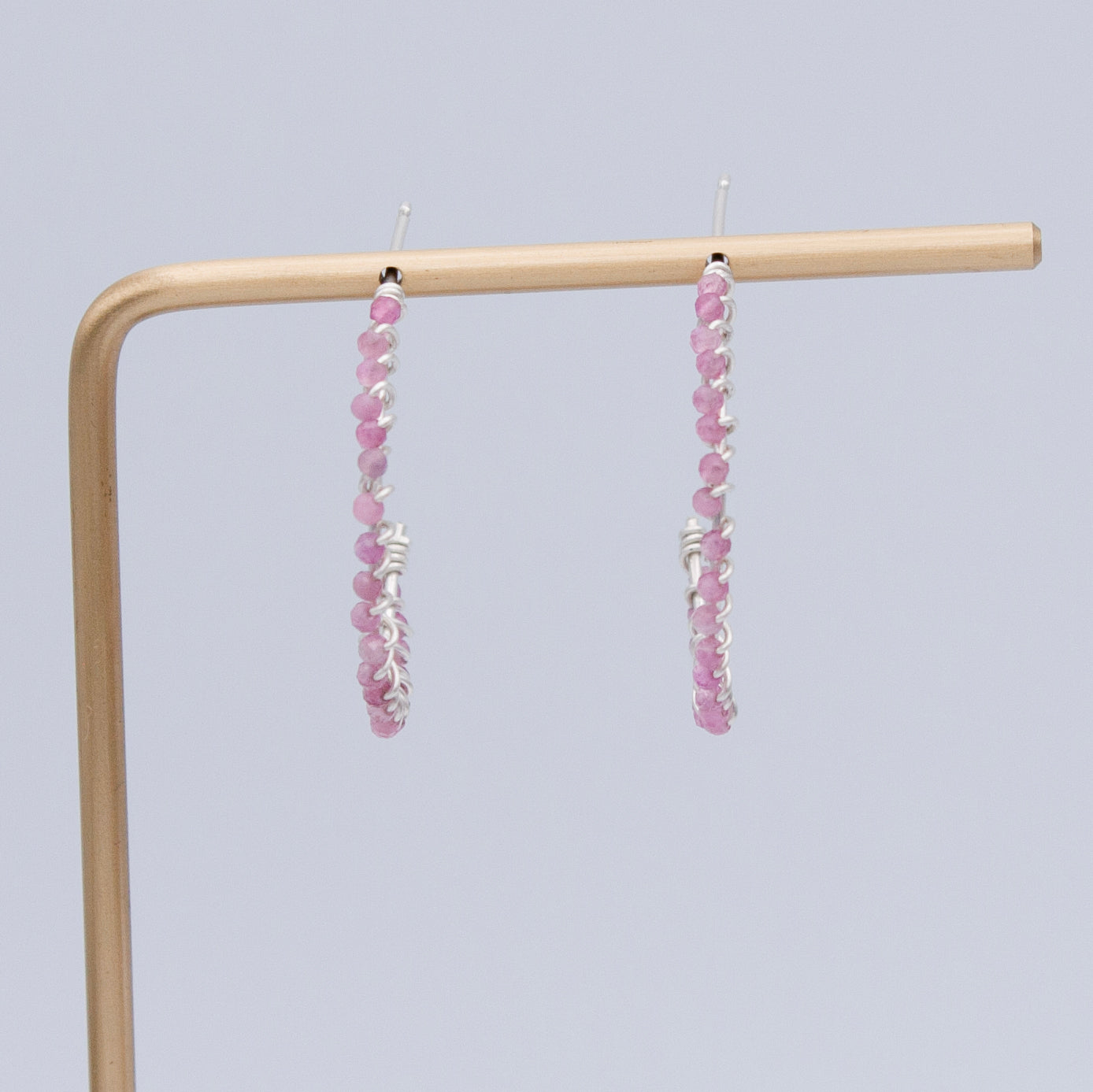Pink tourmaline beaded sterling silver hoop earrings with a sleek, modern design from Grey Clymene jewelry collection.