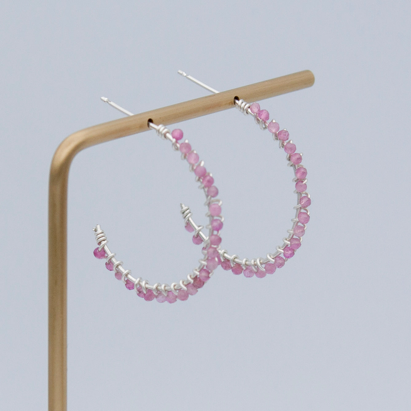 Pink tourmaline beaded sterling silver hoop earrings with a sleek, modern design from Grey Clymene jewelry collection.