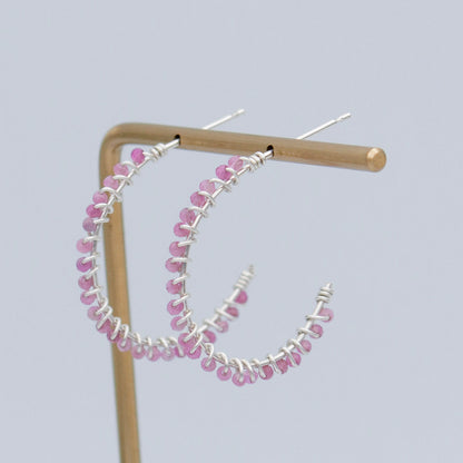 Pink tourmaline beaded sterling silver hoop earrings with a delicate, elegant design.