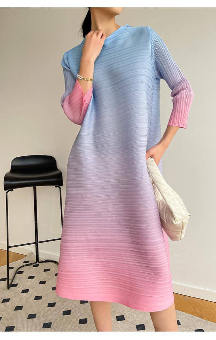 Plus size pleated dress by Carmine Juneberry featuring a flowing silhouette and elegant design for women.