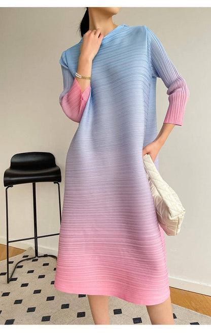 Plus size pleated dress by Carmine Juneberry featuring a flowing silhouette and elegant design for women.