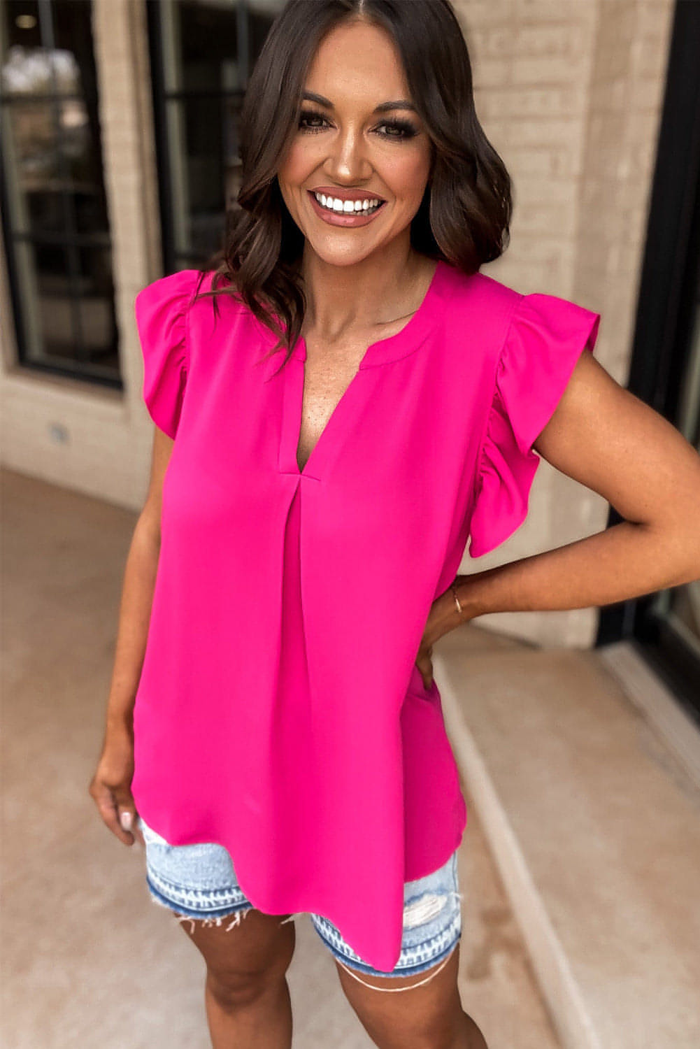 Rose red notched neck ruffle sleeve blouse from Carmine Juneberry, stylish top with feminine ruffle details and notched neckline.