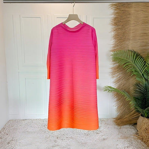 Plus size pleated dress for women by Carmine Juneberry, featuring a flowing, stylish design suitable for various occasions.