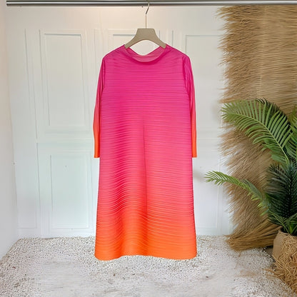 Plus size pleated dress for women by Carmine Juneberry, featuring a flowing, stylish design suitable for various occasions.