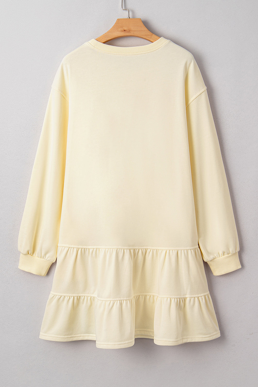 Solid tiered ruffle hem long sleeve dress by Byzantium Bay, featuring a flowy design with layered ruffles and a classic long sleeve silhouette.