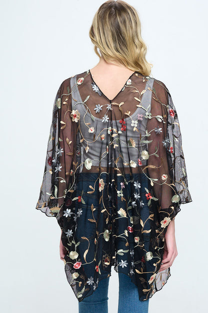 Floral embroidered mesh oversized kimono for women by Indigo Arrowwood, featuring colorful floral patterns and lightweight sheer fabric.