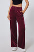Burgundy Carmine Juneberry wide-leg pants with drawstring waist, made of solid fabric, relaxed fit, styled for casual wear