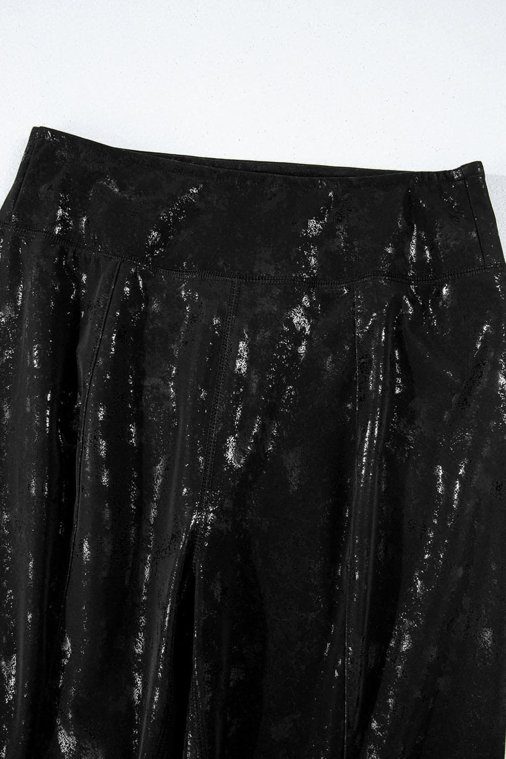 Black faux leather splits high waist leggings from Carmine Juneberry, featuring a sleek fit and stylish design.