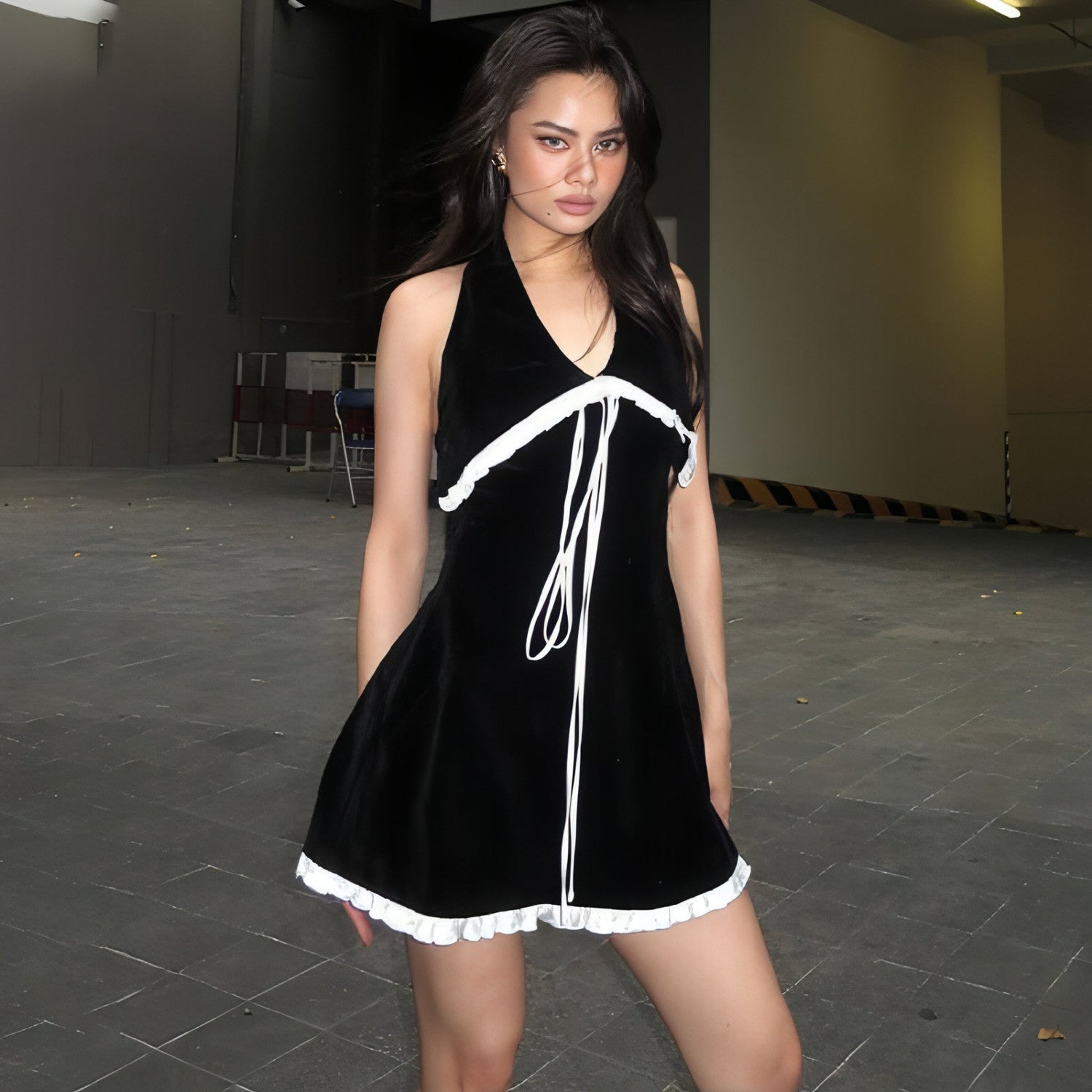 Backless suede halter dress with flounce trim and lace-up back by Carmine Juneberry, slim-fit design for women.