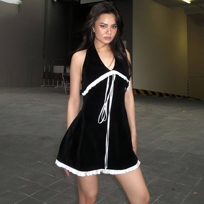 Backless suede halter dress with flounce trim and lace-up back by Carmine Juneberry, slim-fit design for women.