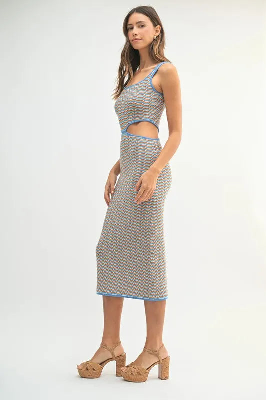 Multi-color chevron knit bodycon midi dress by Pear Daisy, featuring a fitted silhouette and vibrant pattern.