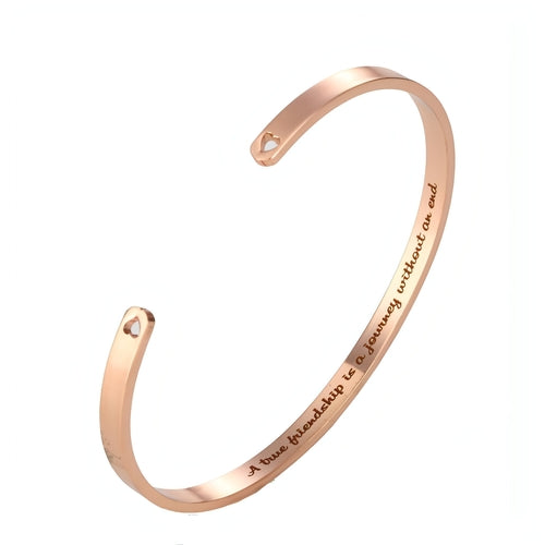 Personalized couple bracelet with sleek steel design for him and her, featuring engraved custom details by Carmine Juneberry.