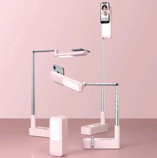 Maroon Asteria selfie portable mobile phone holder with built-in light, designed for hands-free photos and video calls.