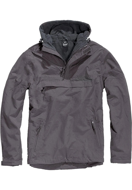 Callisto Essential Windbreaker jacket with lightweight, water-resistant fabric and adjustable hood, shown in a versatile outdoor setting.