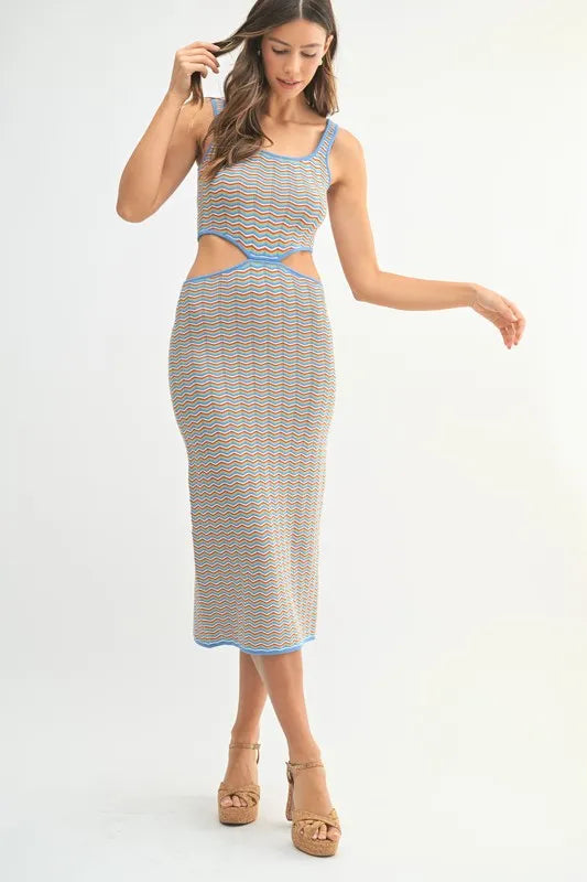 Multi-color chevron knit bodycon midi dress by Pear Daisy, showcasing the fitted design and vibrant pattern.