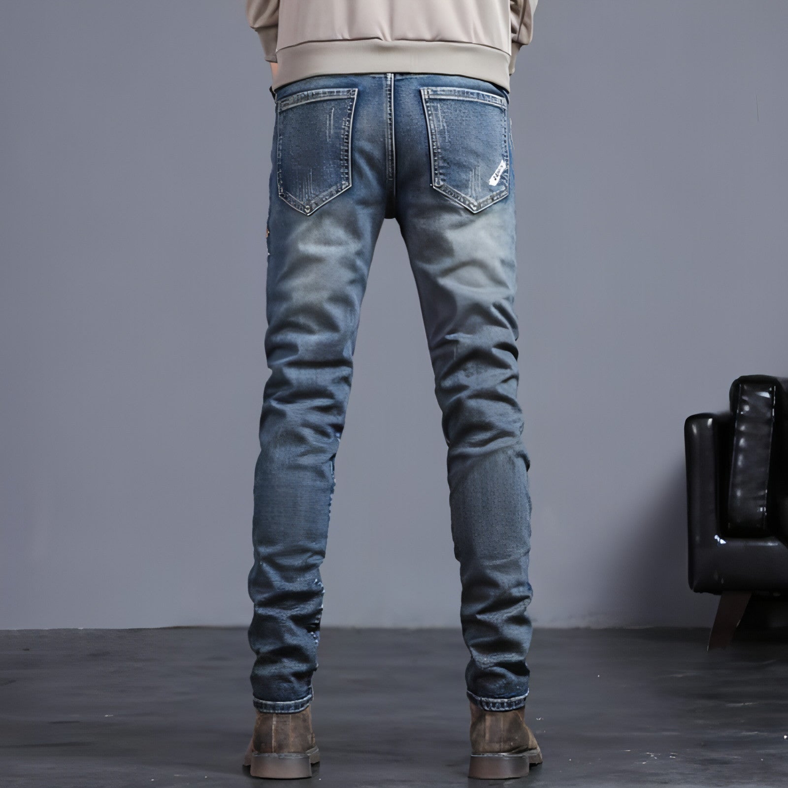 Youth retro embroidered denim pants for men by Carmine Juneberry, featuring classic blue jeans with colorful embroidered details.