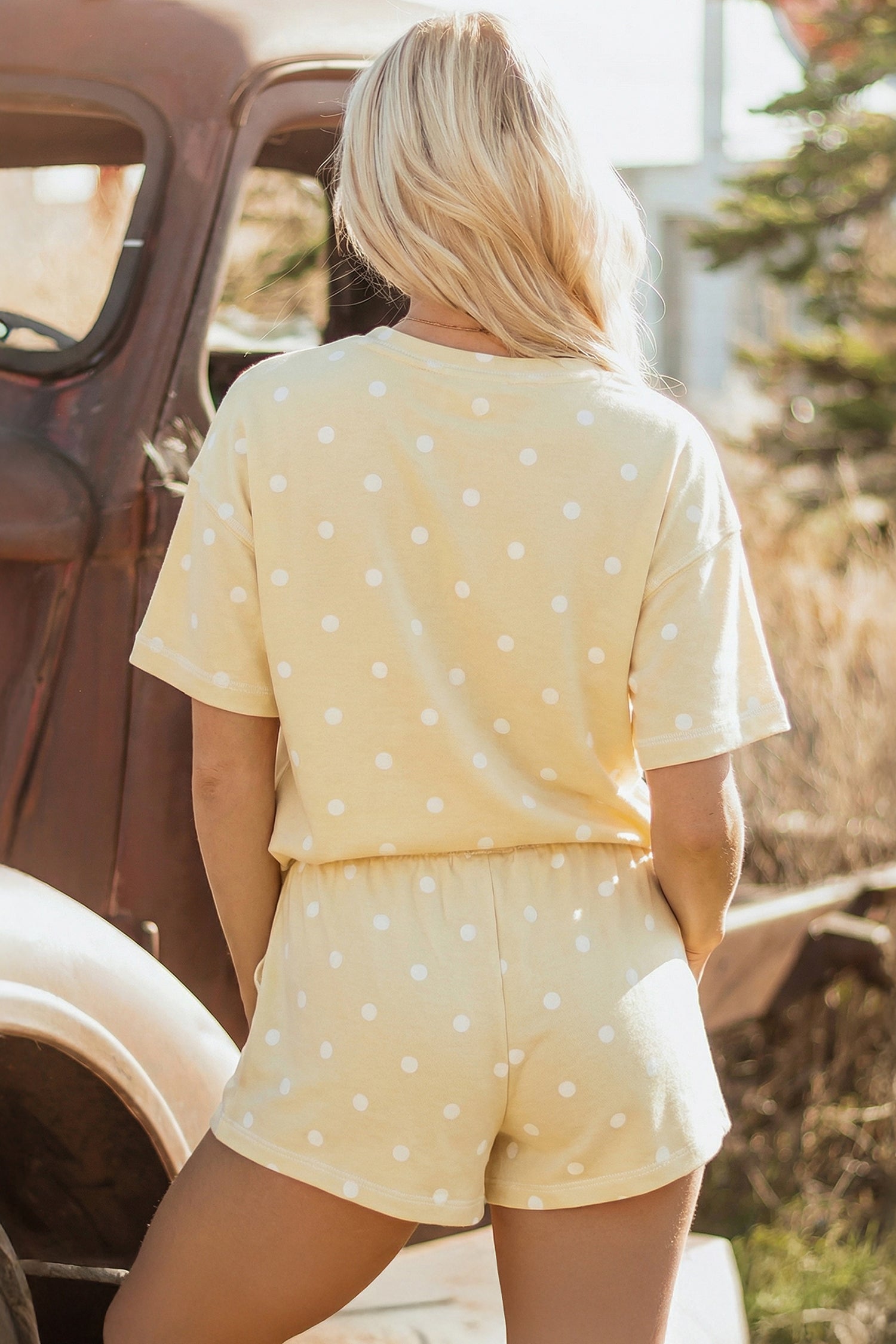 Women’s polka dot loose tee and drawstring shorts set by Byzantium Bay, casual and comfortable lounge outfit.