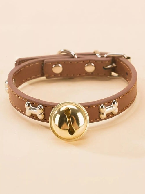 Leather pet collar with bell from Pear Daisy, featuring a durable design and classic style for dogs or cats.