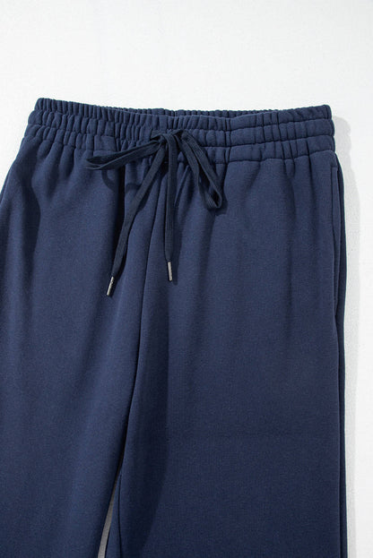Navy blue fleece-lined casual pants with drawstring waist from Carmine Juneberry, comfortable and stylish for everyday wear.