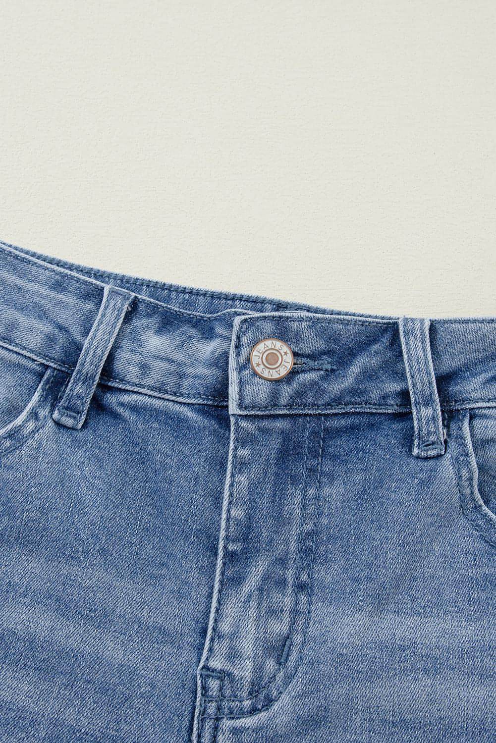 Carmine Juneberry Ashleigh blue acid wash distressed wide-leg high-waist jeans showing faded denim and ripped details.
