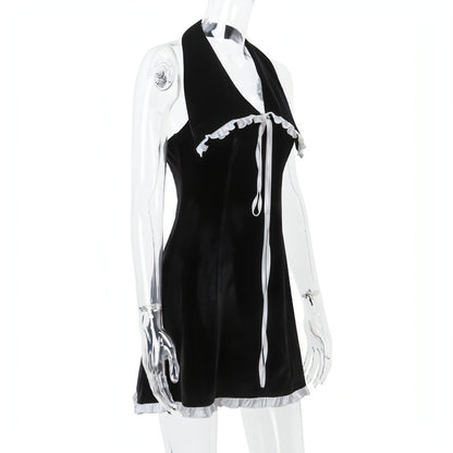 Backless suede halter dress with flounce trim and lace-up detail, slim-fit design by Carmine Juneberry for women.