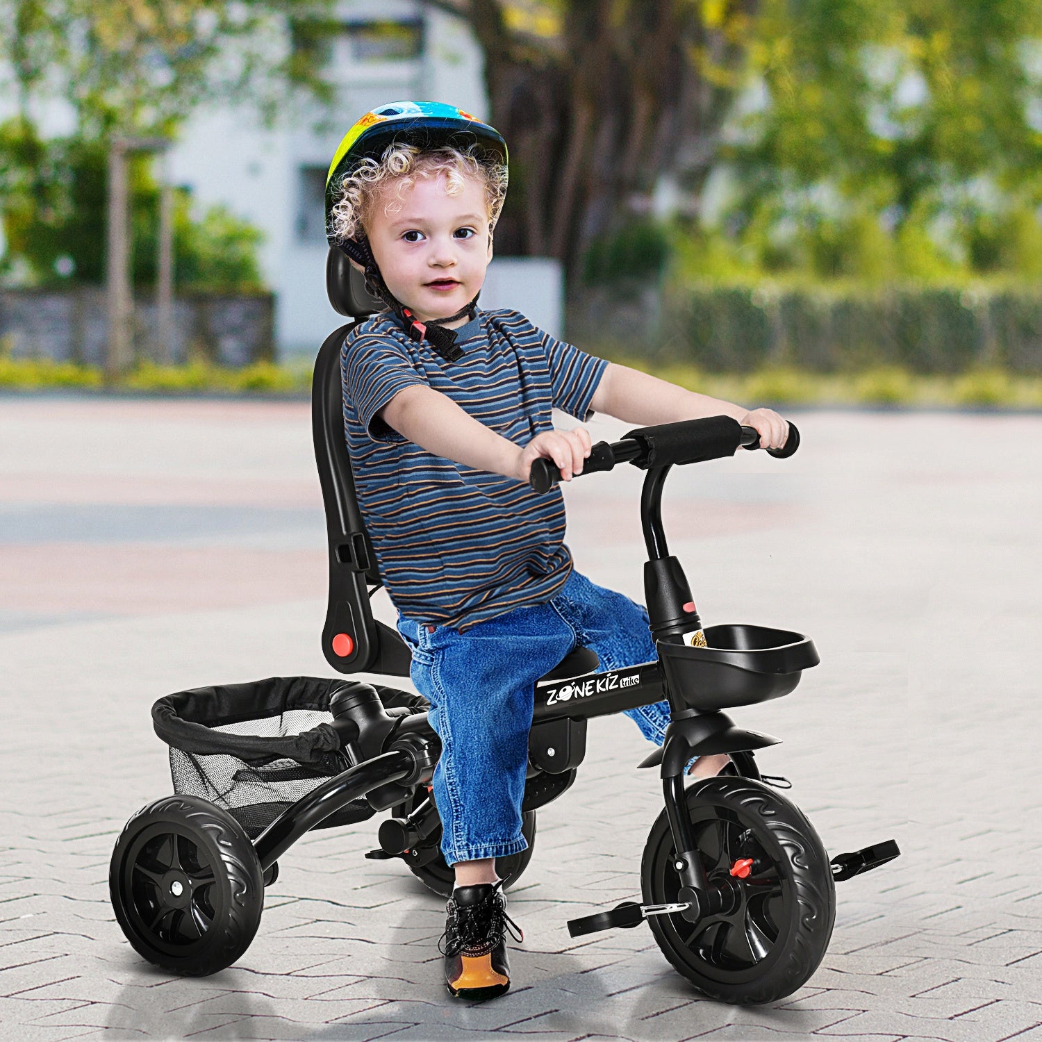 Taupe Shadow Qaba Baby Tricycle 4-in-1 push stroller with reversible seat and adjustable angle for toddlers in a home setting.