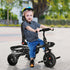 Taupe Shadow Qaba Baby Tricycle 4-in-1 push stroller with reversible seat and adjustable angle for toddlers in a home setting.