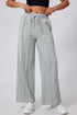 Gray seamed drawstring high waist wide leg sweatpants by Carmine Juneberry, showing the relaxed fit and comfortable fabric.