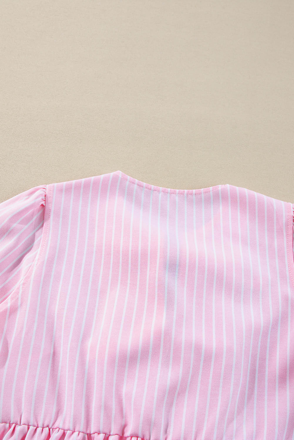 Pink stripe bowknot front blouse with puff sleeves and crew neck from Carmine Juneberry, stylish tops and blouses for women.