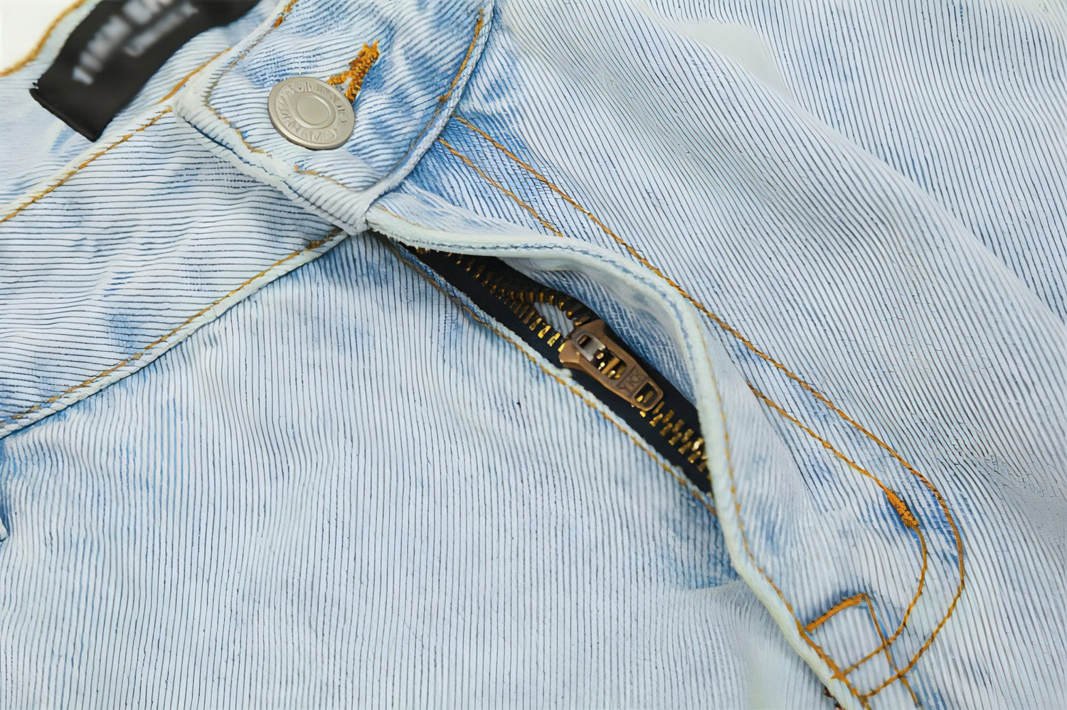 Light wash denim cargo jeans for men by Carmine Juneberry, featuring multiple pockets and a relaxed fit.