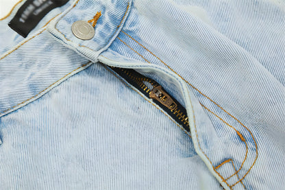 Light wash denim cargo jeans for men by Carmine Juneberry, featuring multiple pockets and a relaxed fit.