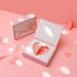 Carmine Juneberry First Love Paris bodycare product, elegant packaging with soft pink accents and floral design.