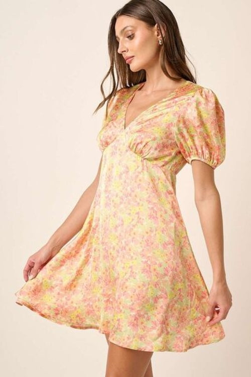 Jade Icarus Mittoshop printed V-neck puff sleeve mini dress for women, featuring colorful patterns and short puffed sleeves.