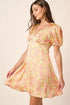 Jade Icarus Mittoshop printed V-neck puff sleeve mini dress for women, featuring colorful patterns and short puffed sleeves.
