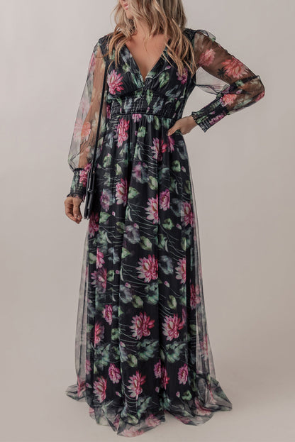 Black mesh sheer shirred high waist floral maxi dress by Harlequin Daisy, featuring a flowing design with floral patterns.