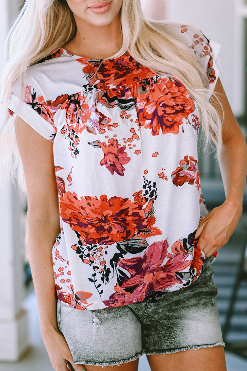Fiery red floral short sleeve blouse by Carmine Juneberry featuring a round neck and stylish design, perfect for casual wear.