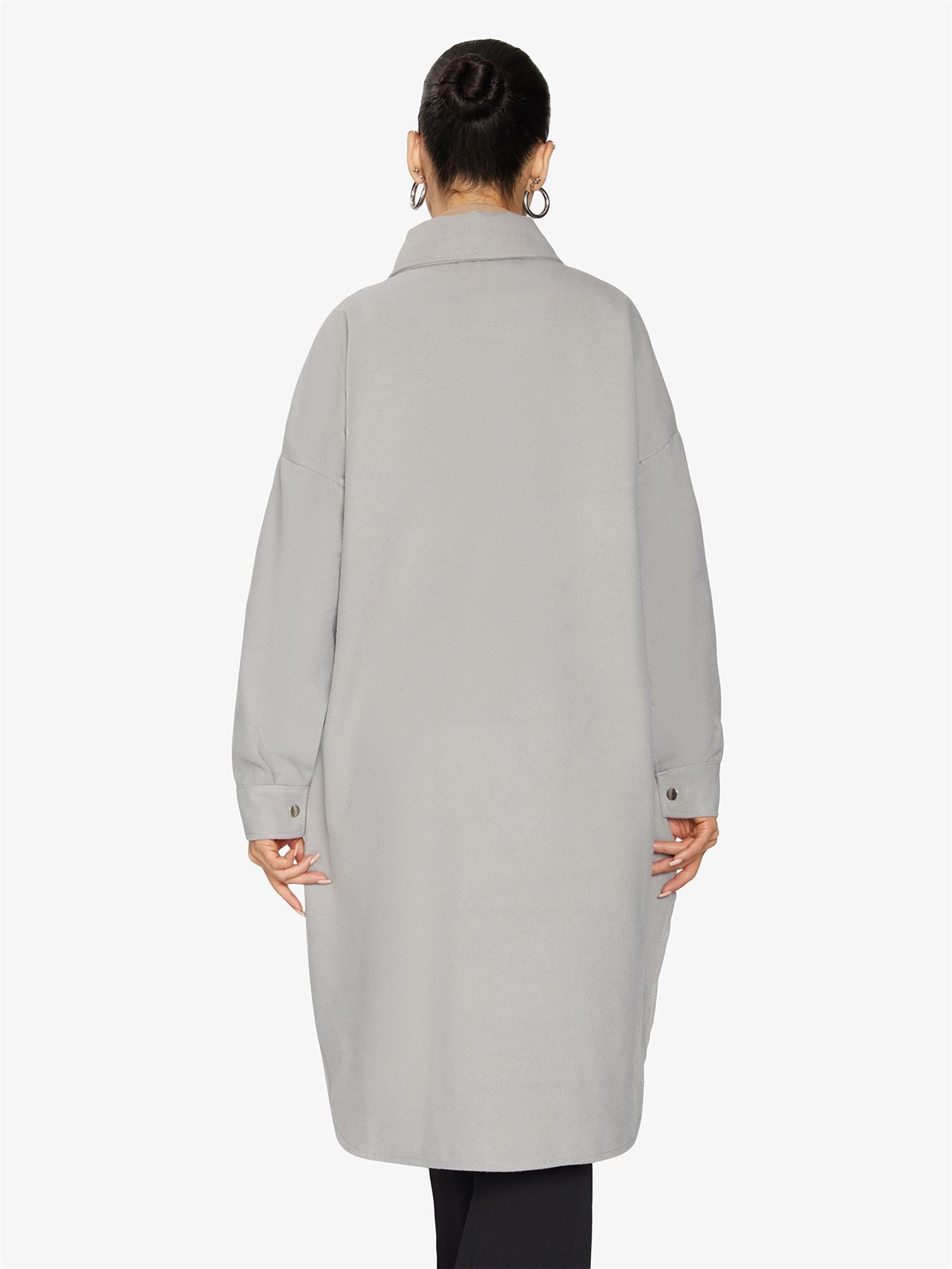 Rose Eleusis oversized longline shacket in neutral fabric, displayed hanging with button details and relaxed fit.