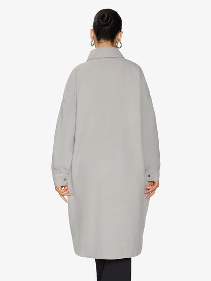 Rose Eleusis oversized longline shacket in neutral fabric, displayed hanging with button details and relaxed fit.