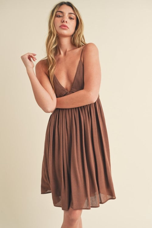 Jade Icarus Aemi + Co ruched plunge mini cami dress for women, showing the fitted, ruched design with a plunging neckline.
